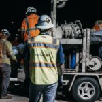 Nor-Cal Pipeline Services crew working on underground utility infrastructure at night, highlighting the benefits of employee ownership through an ESOP.